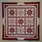 9 Feathered Stars Plus 1 Red Square By Judy Riddle